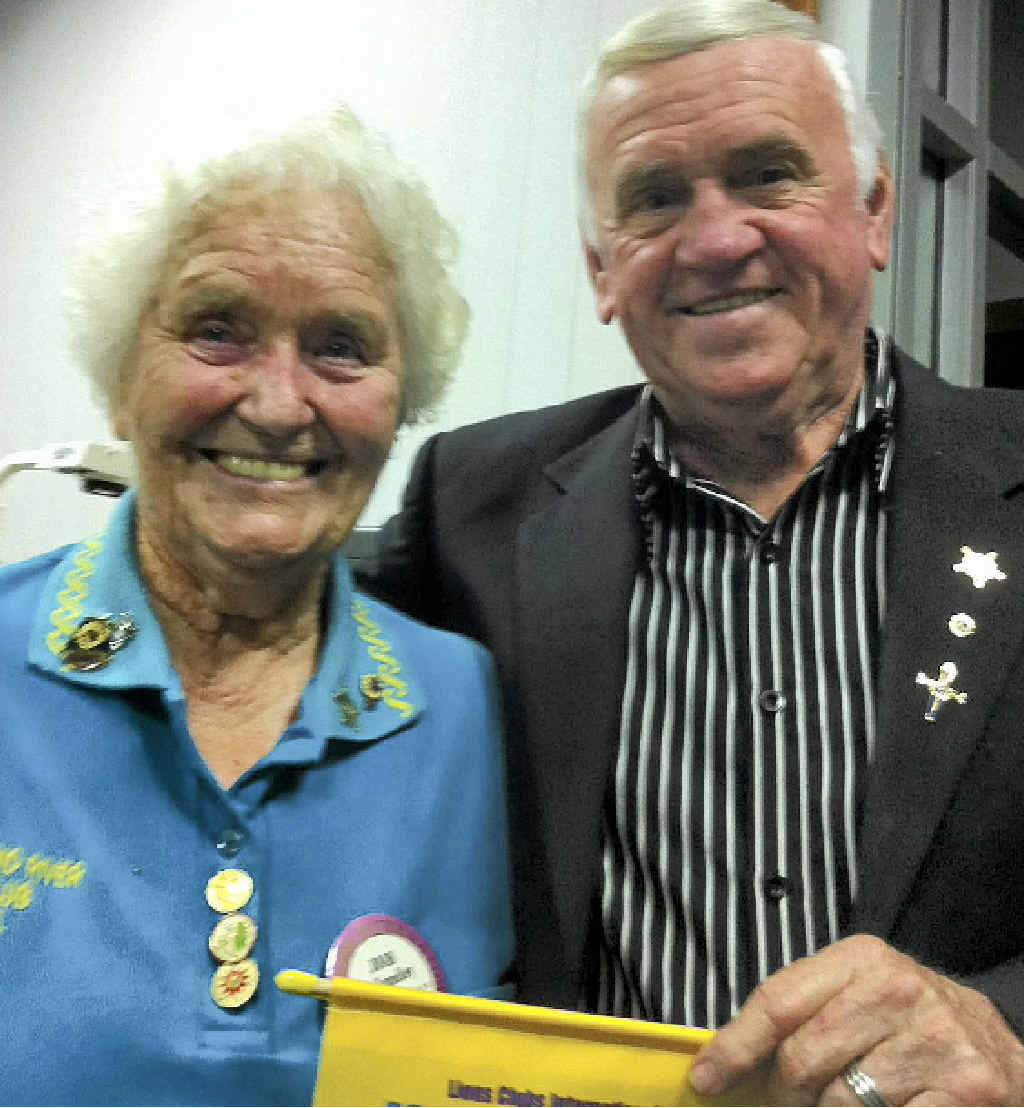 LIONS AWARD: Lion member Joan Smedley of the Mid Richmond Lions Clube receives her award from Lions District Governor Mervyn Ferguson. LIONS AWARD: Lion member Joan Smedley of the Mid Richmond Lions Clube receives her award from Lions District Governor Mervyn Ferguson.